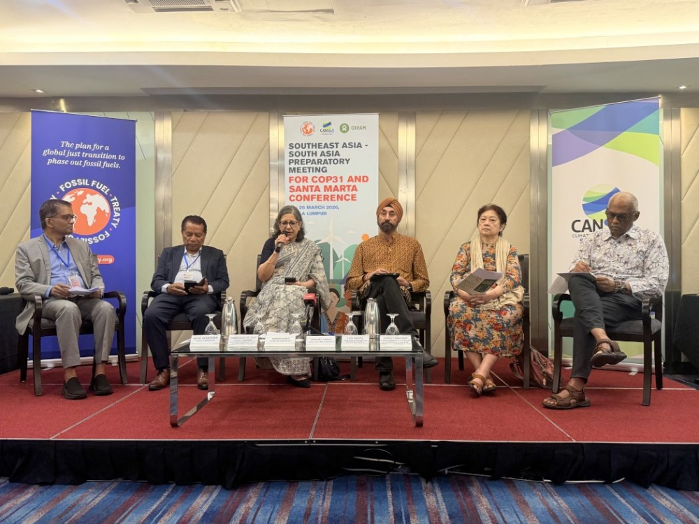 Panellists attend a conference on the impact of the US-Iran war on climate change, in Petaling Jaya