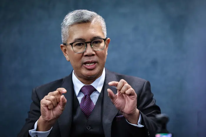 Tengku Zafrul gesturing as he speaks during an interview